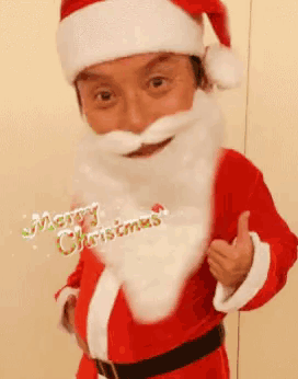 a man dressed as santa claus is giving a thumbs up and says merry christmas