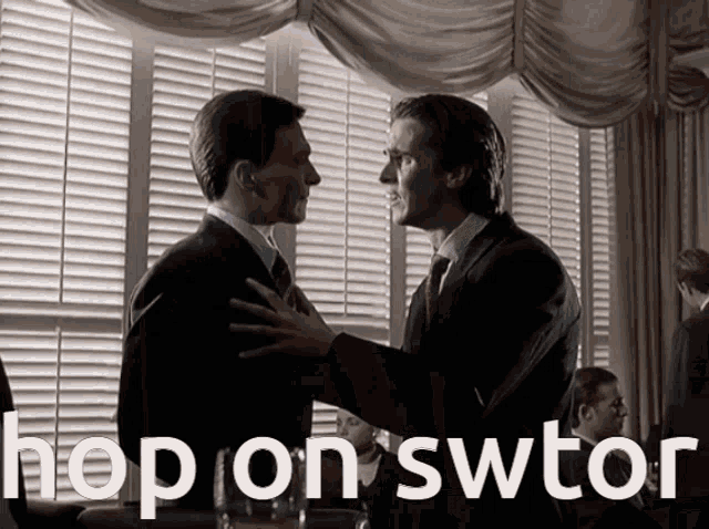 a man in a suit and tie is hugging another man with the words hop on swtor below them