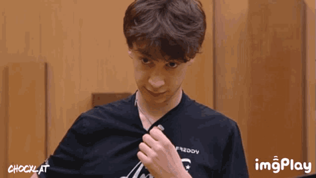 a man wearing a black shirt that says freddy
