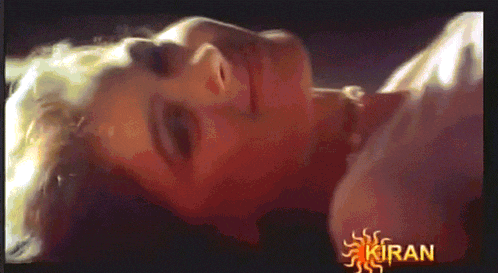 a close up of a woman 's face with the word kiran in the corner