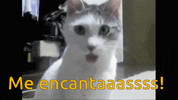 a white cat with a surprised look on its face and the words me encantaassss on the bottom