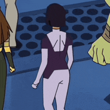 a woman in a purple shirt has the letter v on the back