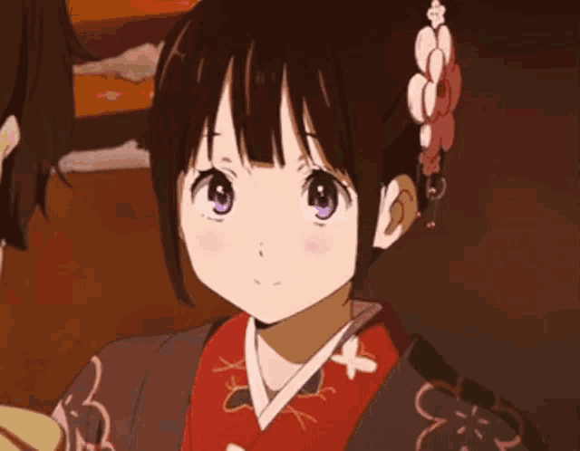 a girl with her eyes closed wearing a kimono