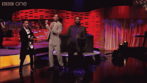 a group of men are dancing on a stage with bbc one written on the bottom