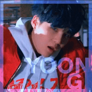 a young man with blue hair is wearing a red jacket and a white hoodie with the word yoongi on it