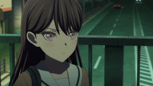 a girl with long brown hair and pink eyes stands on a bridge