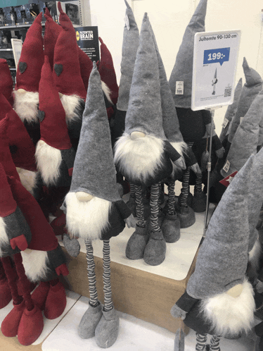 a display of stuffed gnomes with a sign that says 199