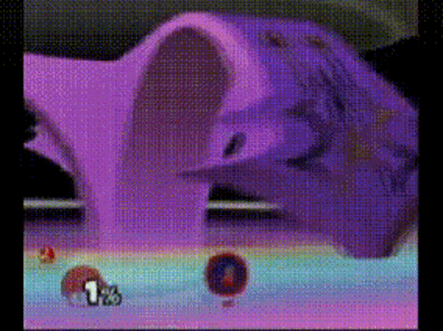 a video game screen shows a purple object with the number 1 on it ..