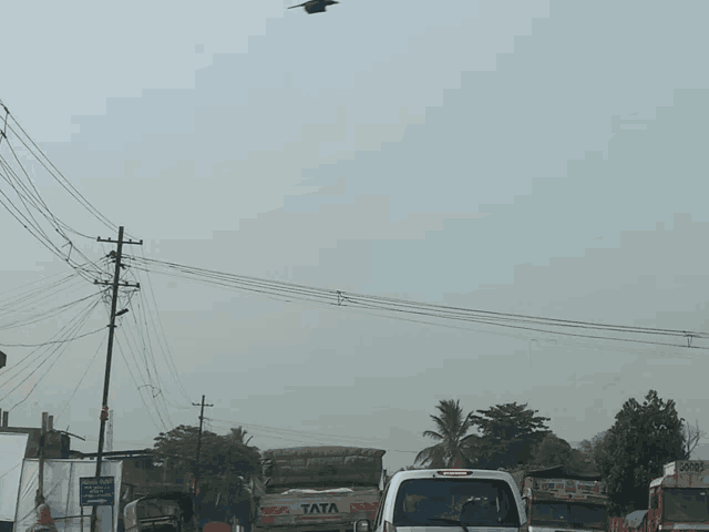 a tata truck is driving down the road