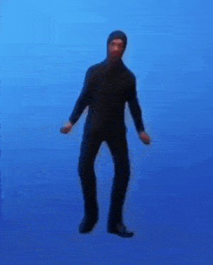 a man is dancing in front of a blue background .