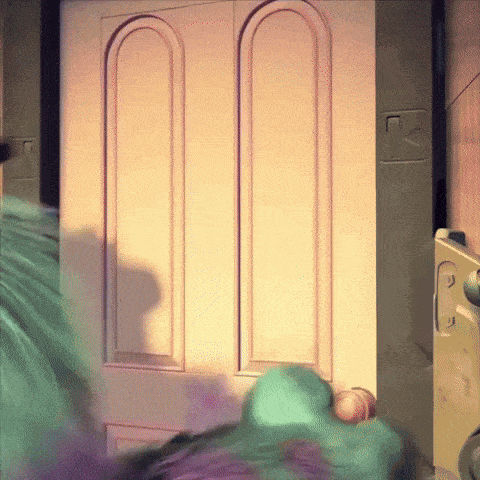 a monster from a cartoon is standing in front of a door with a lock on it
