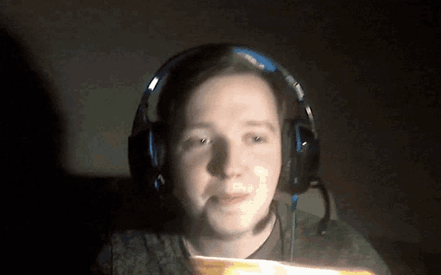 a man wearing headphones with a microphone on his head