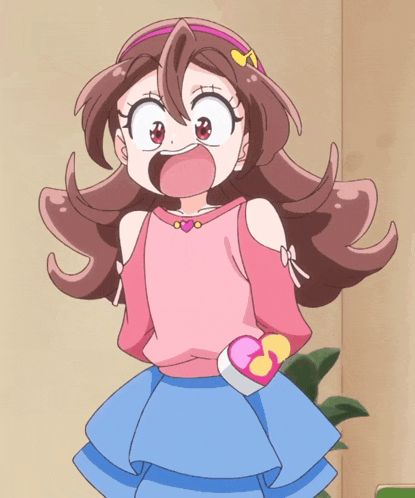 a girl in a pink top and blue skirt holds a heart shaped object in her hand