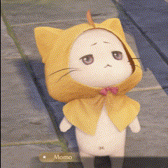 a stuffed cat wearing a yellow cape with ears and a bow