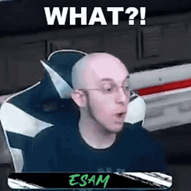 a bald man is sitting in a chair with his mouth open and the words `` what ? '' written above him .