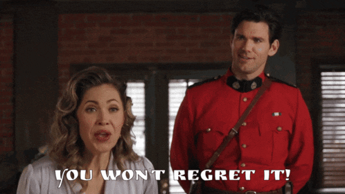 a man in a red uniform is standing next to a woman who says " you won 't regret it "