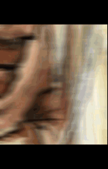 a blurry picture of a person 's face with a few lines