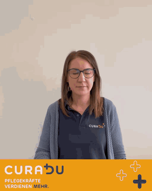 a woman wearing glasses and a blue shirt that says curabu
