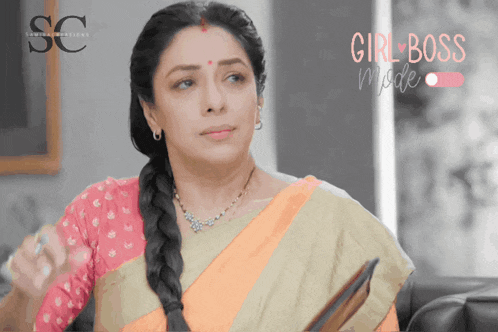 a woman sitting on a couch with the words girl boss mode on the bottom right