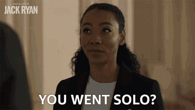 a woman says " you went solo " in front of a sign that says jack ryan