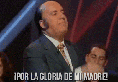 a man in a suit and tie is saying por la gloria de mi madre !