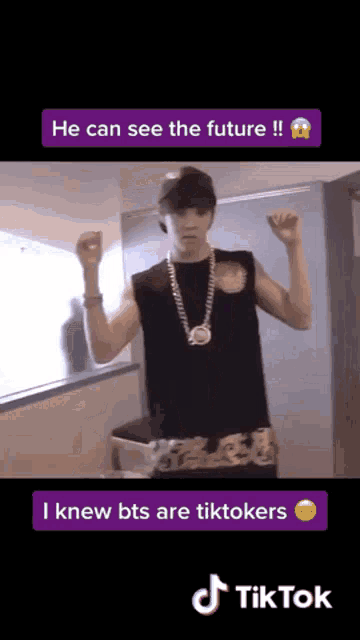 a man wearing a hat and a necklace is dancing on a tik tok video .