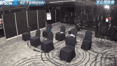 a room with chairs and a sign that says miracle # 2 tomoya