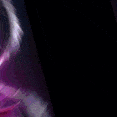 a close up of a dragon 's eye with a purple glow