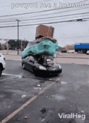 a car with the hood open and a bunch of stuff on it