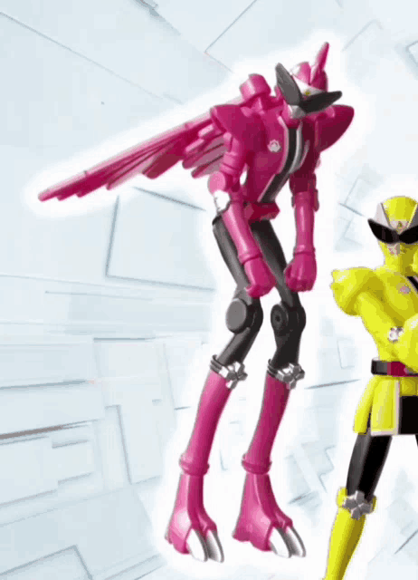 a pink robot is standing next to a yellow toy