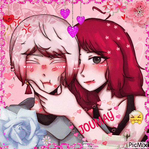 a girl with red hair is putting her hand on another girl 's cheek