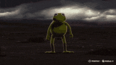 a frog is standing in the middle of a desert with red flames coming out of its arms and legs .
