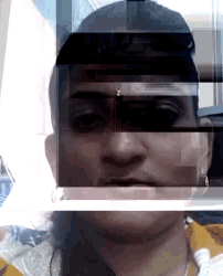 a blurry picture of a person 's face with the letter u in the corner