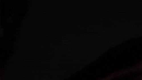 a close up of a person 's face with a monster crawling out of it
