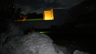 a blurry picture of a person in a red dress in the dark