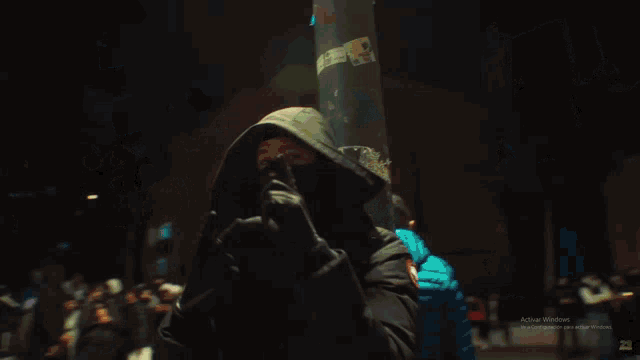 a group of people are posing for a picture and one of them is wearing a hoodie that says " coca cola " on it