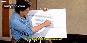 a man is holding a sign that says google