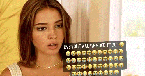 a woman is holding a sign with a bunch of emojis on it .
