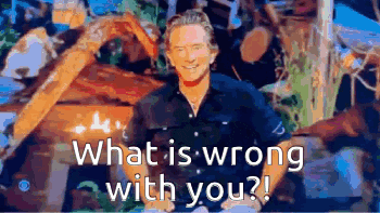 a man in a blue shirt is asking what is wrong with you ?