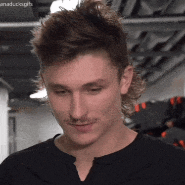 a close up of a man 's face with anaducksgifs written on the bottom