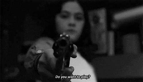 a black and white photo of a girl holding a gun with the words do you want to play below her