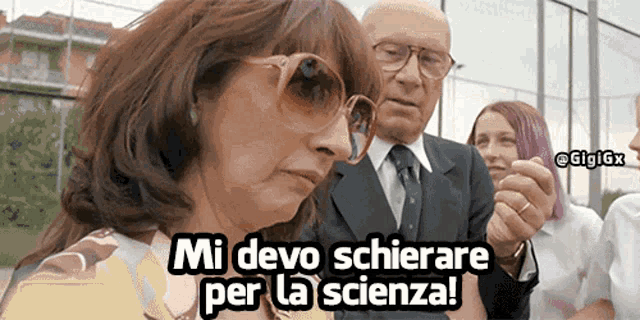 a woman wearing sunglasses says " mi devo schiere per la scienza " in front of a man in a suit