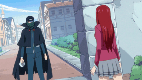 a man in a black cape is standing next to a woman in a red skirt