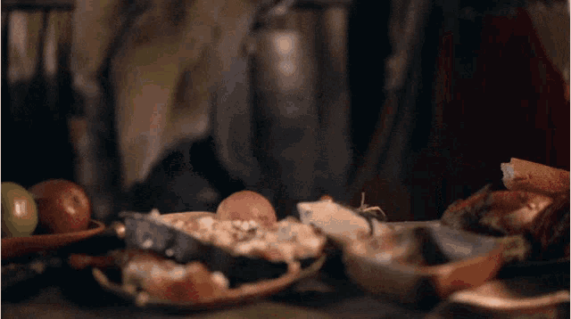 a blurred image of a table with plates of food