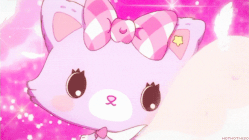a purple cat with white wings and a pink bow