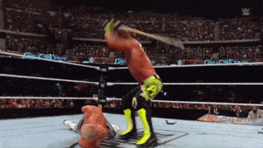 a man in a wrestling ring with a sign that says ' castle castle ' on it