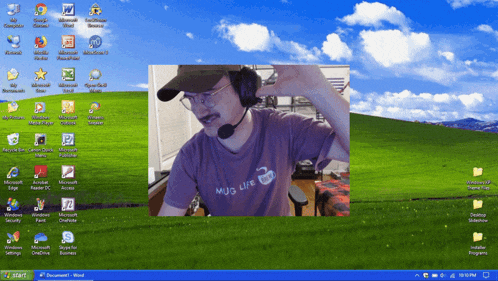 a man wearing a mug life shirt is on a computer screen