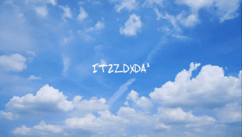 a blue sky with white clouds and the words itzzdxda