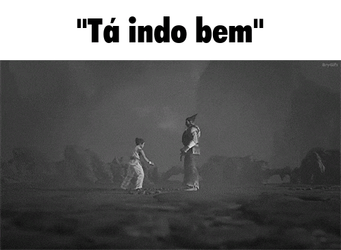 a black and white photo of two people standing next to each other and the caption " ta indo bem "