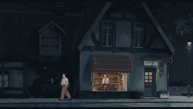 a man walking in front of a bakery that says ' bakery ' on the front